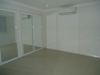 View profile: Air Conditioning & Tiled Throughout
